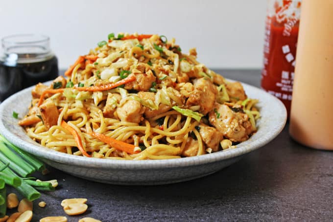 California Pizza Kitchen Copycat Thai Chicken Pasta is full of chicken, vegetables, and a honey-peanut sauce full of umami. Easy to make at home, put the take-out menus away!