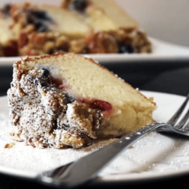 Slice of cake served on plate with fork