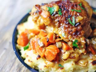 The richest mashed potatoes with five kinds of dairy! They are tangy, cheesy, rich and creamy with a deliciousy crisp crust out of the oven.