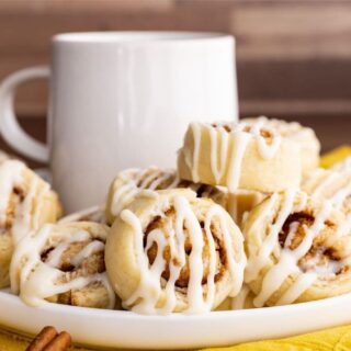 Cinnamon Roll Sugar Cookies on plate with coffee cup