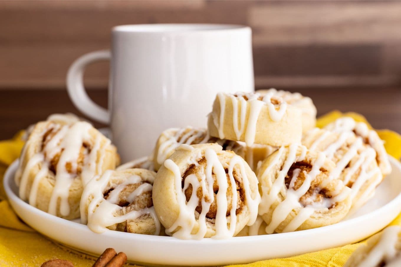 Cinnamon Roll Sugar Cookies on plate with coffee cup