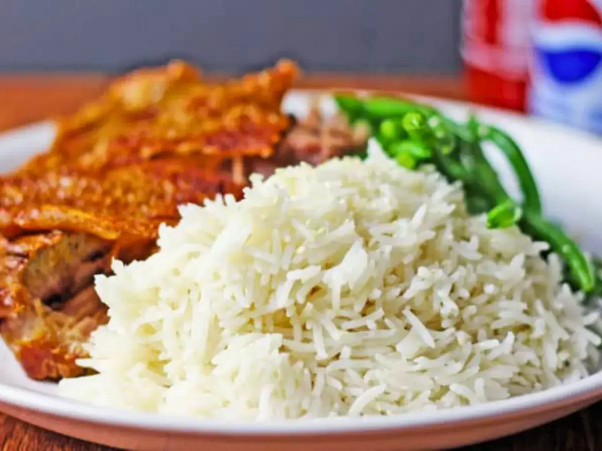 Rice with meat and veggies in the backgroung