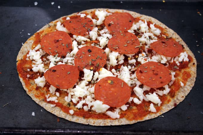 Weight Watchers Pepperoni Pizza baked on a whole wheat tortilla with melty mozzarella and pepperoni, this pizza is one of the most satisfying ways you can enjoy a 6 point meal! 