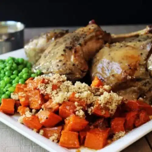 Plated dinner with turkey, peas and potatoes