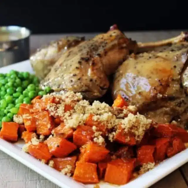 Plated dinner with turkey, peas and potatoes