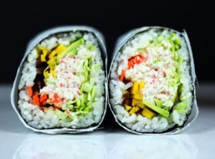 Try the trend taking over the Bay Area in California! Sushi gets supersized with an imitation crab meat sushi burrito that is filled with imitation crab, cucumber, avocado, carrots and napa cabbage. Serve with spicy mayo, and soy sauce and laugh at all the normal sized california rolls people are still eating.