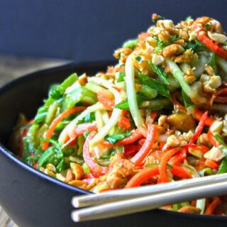 slaw served in a Black Bowl with Chopsticks on the side