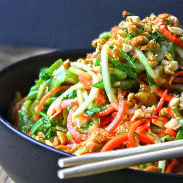 slaw served in a Black Bowl with Chopsticks on the side