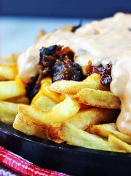 Animal-Style French Fries are fried golden brown, topped with melty American Cheese, buttery melted caramelized onions and a signature fry sauce. Serve with a fork or eat with your fingers if you dare, these fries are a cult favorite!