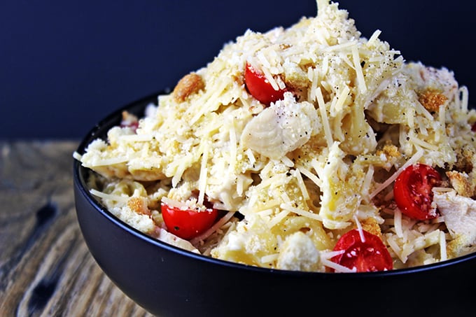 5 Minute Chicken Caesar Pasta Salad is so quick to make and so delicious you will put this in your regular rotation for lunches, parties, picnics and bbqs! It comes together in just minutes and is just 5 ingredients! Cold chicken breast, Litehouse Caesar Caesar Dressing, croutons, Parmesan cheese and grape tomatoes are all you need to enjoy this meal. Meant to be eaten cold, I have also been known to microwave it so the Parmesan cheese melts together and guess what, the dressing is amazing warm too.