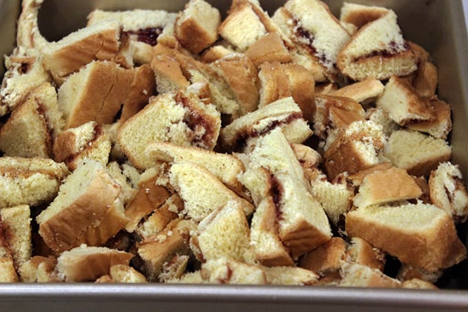 Peanut Butter and Jelly Uncrustables that you can make with your little ones using cookie cutters and instead of having leftover crusts that no one wants you bake it into a delicious Peanut Butter & Jelly French Toast Casserole! NO WASTE! It is a delicious brunch dish you can even serve company! 