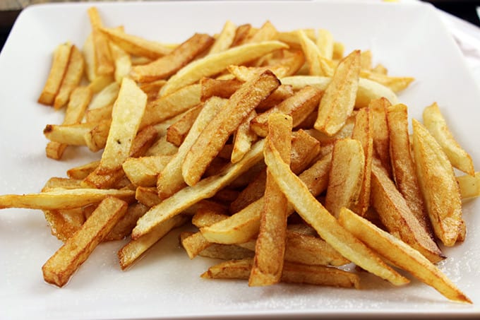 Animal-Style French Fries are fried golden brown, topped with melty American Cheese, buttery melted caramelized onions and a signature fry sauce. Serve with a fork or eat with your fingers if you dare, these fries are a cult favorite!
