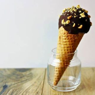 Chocolate dipped ice cream cone in small glass jar