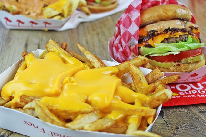 Animal-Style French Fries are fried golden brown, topped with melty American Cheese, buttery melted caramelized onions and a signature fry sauce. Serve with a fork or eat with your fingers if you dare, these fries are a cult favorite!