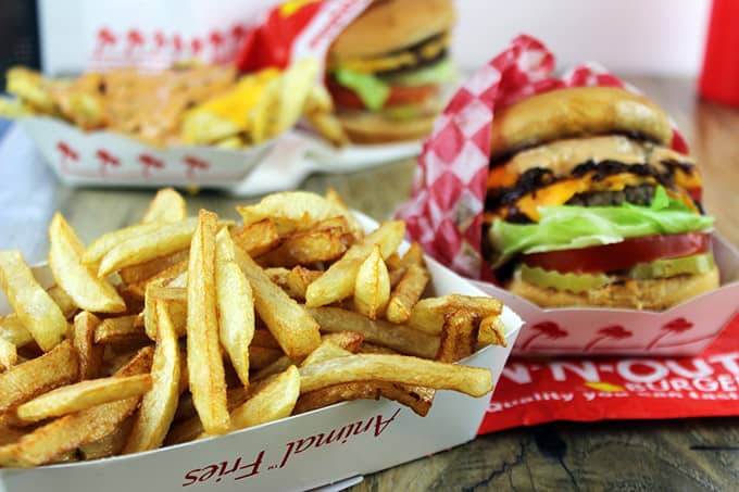 Animal-Style French Fries are fried golden brown, topped with melty American Cheese, buttery melted caramelized onions and a signature fry sauce. Serve with a fork or eat with your fingers if you dare, these fries are a cult favorite!