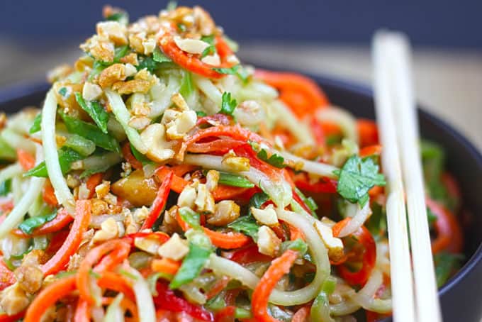 A fresh, crunchy Asian Lime-Peanut Slaw with fresh cucumbers, carrots and bell peppers. Seasoned with sesame oil, lime juice and peanut butter this dish will make your friends and family think you're a rockstar in the kitchen!