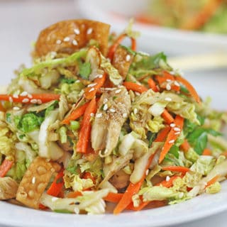 Chinese salad heaped onto white plate
