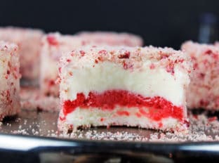 Strawberry Shortcake Bars are made with rich Vanilla Ice Cream sandwiched around Fresh Strawberry Sorbet and rolled in a deliciously nostalgic strawberry crumb topping with a butter crumb made with milk powder and freeze dried strawberries. I promise you'll feel like you took a trip back into your childhood when you take a bite but you will love that they are made with natural flavors!