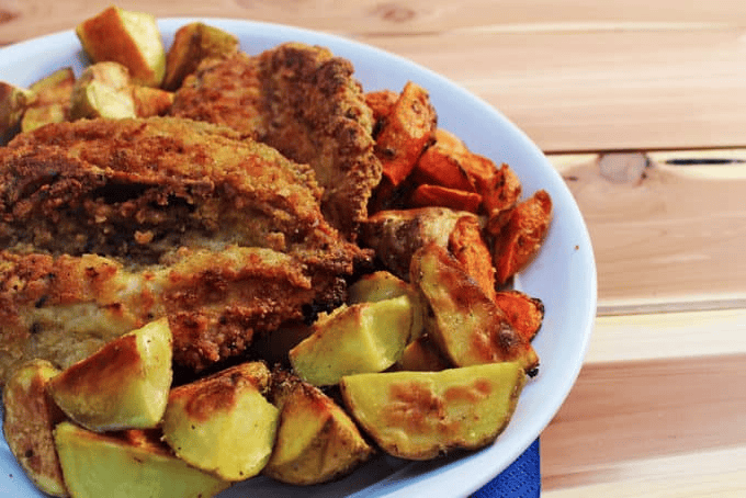 Chicken dinner on a white plate