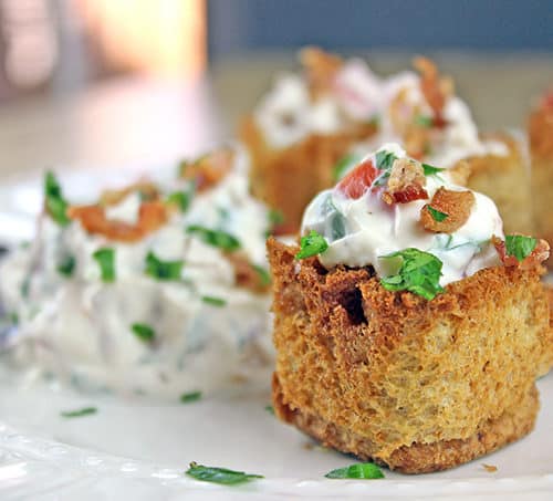 These little BLT bites are full of your favorite Bacon, Lettuce & Tomato Sandwich flavors in a small crispy bread cup. Made with cream cheese, sour cream, tomatoes, bacon and parsley, they are a fantastic holiday or football party food!