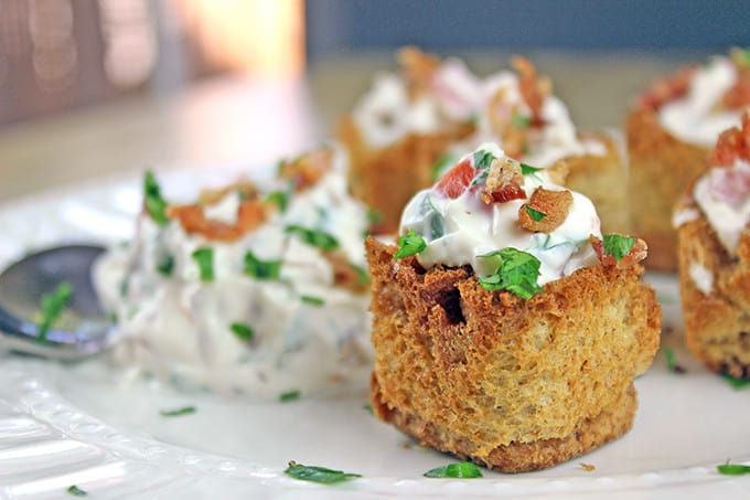 These little BLT bites are full of your favorite Bacon, Lettuce & Tomato Sandwich flavors in a small crispy bread cup. Made with cream cheese, sour cream, tomatoes, bacon and parsley, they are a fantastic holiday or football party food!