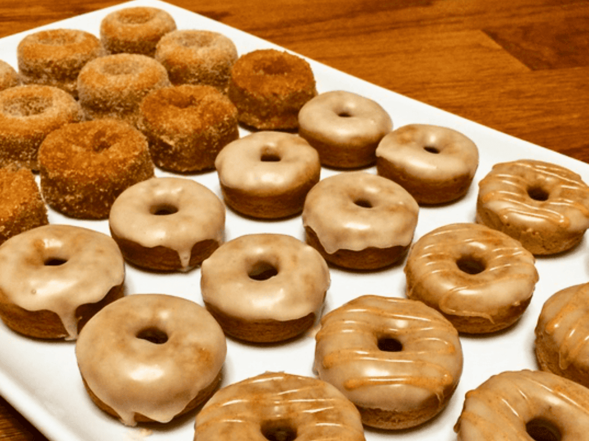 table full of decorated donuts
