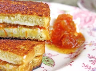 Carrot Cake Grilled Cheese Sandwiches made with homemade Carrot Cake Jam, cream cheese and buttery griddled bread! Cut into sticks or triangles for a fun kid friendly sandwich, or skip the butter and griddle and serve these up at your next tea party!