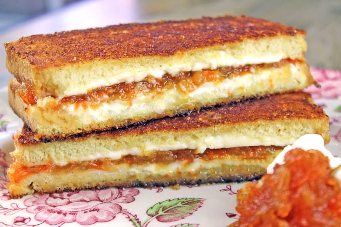 Carrot Cake Grilled Cheese Sandwiches made with homemade Carrot Cake Jam, cream cheese and buttery griddled bread! Cut into sticks or triangles for a fun kid friendly sandwich, or skip the butter and griddle and serve these up at your next tea party!
