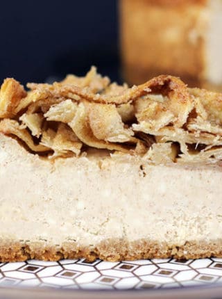 A tall, creamy, rich NY-Style Cinnamon Cheesecake topped with crispy, buttery, cinnamon sugar tortillas. This Cheesecake has it all, a rich taste with a hint of cinnamon spice topped with a crispy sweet crunch, it is a showstopper of a dessert!