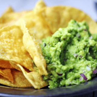 Chips and guac on a plate