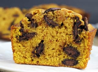 Pumpkin Chocolate Bread filled with delicious Milk Chocolate disks and a perfect breakfast or dessert! This recipe comes together in just a few minutes and doesn't need a mixer to make your house smell like Fall is here!