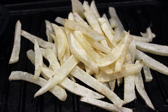 Animal-Style French Fries are fried golden brown, topped with melty American Cheese, buttery melted caramelized onions and a signature fry sauce. Serve with a fork or eat with your fingers if you dare, these fries are a cult favorite!