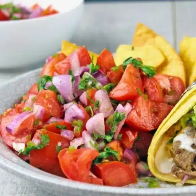 pico de gallo on a plate with taco and chips