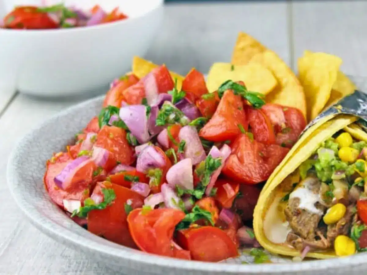 pico de gallo on a plate with taco and chips