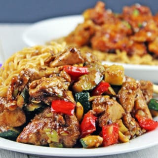 cooked chicken and veggies plated with chow mein