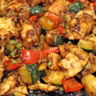 close up of cooked chicken pieces and veggies
