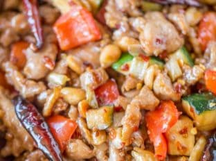 Panda Express Kung Pao Chicken is Full of spicy chicken, zucchini, red bell peppers and crunchy peanuts in an easy ginger garlic sauce, this recipe is authentically Panda Express!