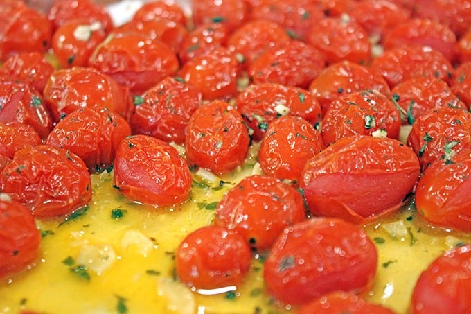 Hold on to those fleeting memories of summer with these amazing Roasted Garlic Tomatoes made in just 15 minutes and versatile enough to be an appetizer, part of a main course or a fantastic spread on a sandwich!