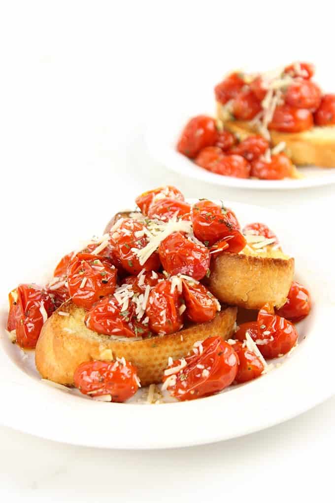 Hold on to those fleeting memories of summer with these amazing Roasted Garlic Tomatoes made in just 15 minutes and versatile enough to be an appetizer, part of a main course or a fantastic spread on a sandwich!