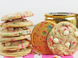 Chewy, crispy delicious cookies that taste like a delicious birthday cake covered in sprinkles! A perfect treat for a birthday lunch or a birthday party dessert table, these cookies will put a huge smile on your face.