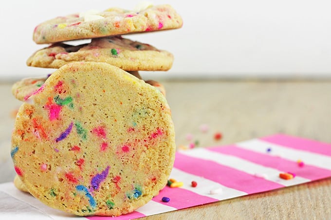 Chewy, crispy delicious cookies that taste like a delicious birthday cake covered in sprinkles! A perfect treat for a birthday lunch or a birthday party dessert table, these cookies will put a huge smile on your face.