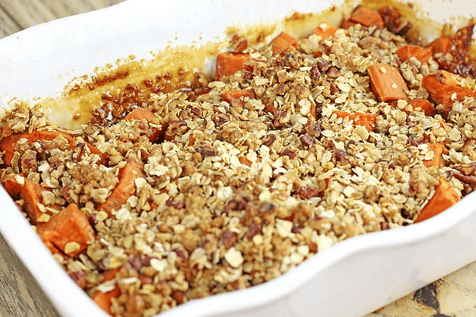 Pan with oat and pecan topping over sweet potatoes