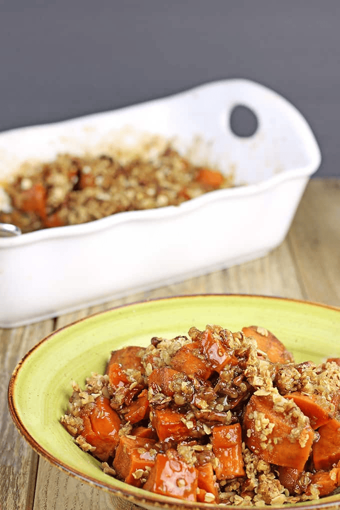 Sweet potato dish in a bowl with a casserole dish in the background