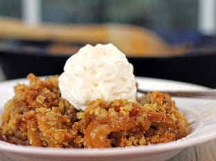 A Fall favorite full of sliced apples, cinnamon, brown sugar, butter and oats baked crisp. Top with whipped cream for a perfect cold weather favorite or top with a scoop of ice cream you're still experiencing this never-ending heat wave with the rest of us.
