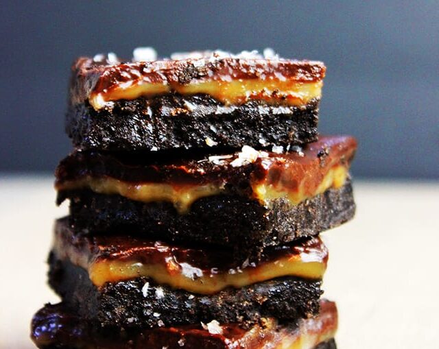 stack of Salted caramel and chocolate bars with Oreo crust.