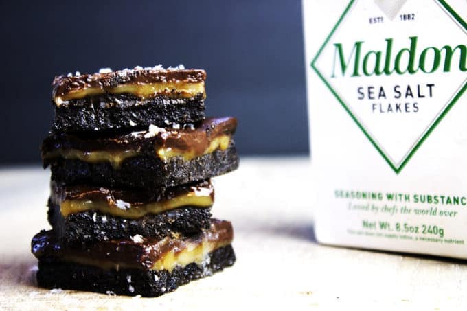 Salted caramel bars stacked on a counter