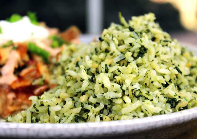 You'll feel like you've sat down to a meal in your favorite mexican restaurant with this slightly spicy Green Mexican Rice made with Cilantro, Jalapeno, Garlic, Spinach and chicken stock. 2 minutes in the extra prep added to your normal rice and you'll LOVE the added flavor!