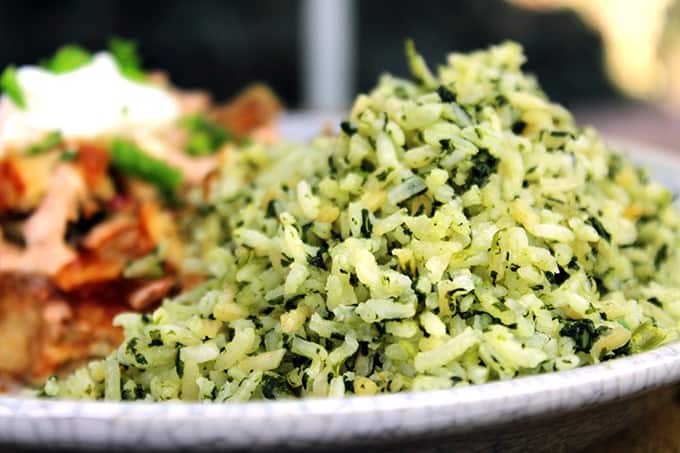 You'll feel like you've sat down to a meal in your favorite mexican restaurant with this slightly spicy Green Mexican Rice made with Cilantro, Jalapeno, Garlic, Spinach and chicken stock. 2 minutes in the extra prep added to your normal rice and you'll LOVE the added flavor!