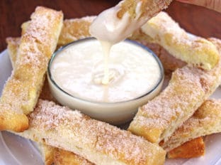 Sweet Cinnamon Stix (Pizza Sticks) like the ones from Domino's... but better because of real butter! and sweet vanilla dipping sauce make pizza night at home feel like you ordered out.
