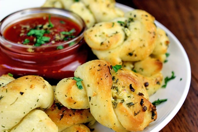 Homemade Pizzeria Garlic Knots with Dipping Sauce! Easy and addictive, so inexpensive to make you'll never order them again!
